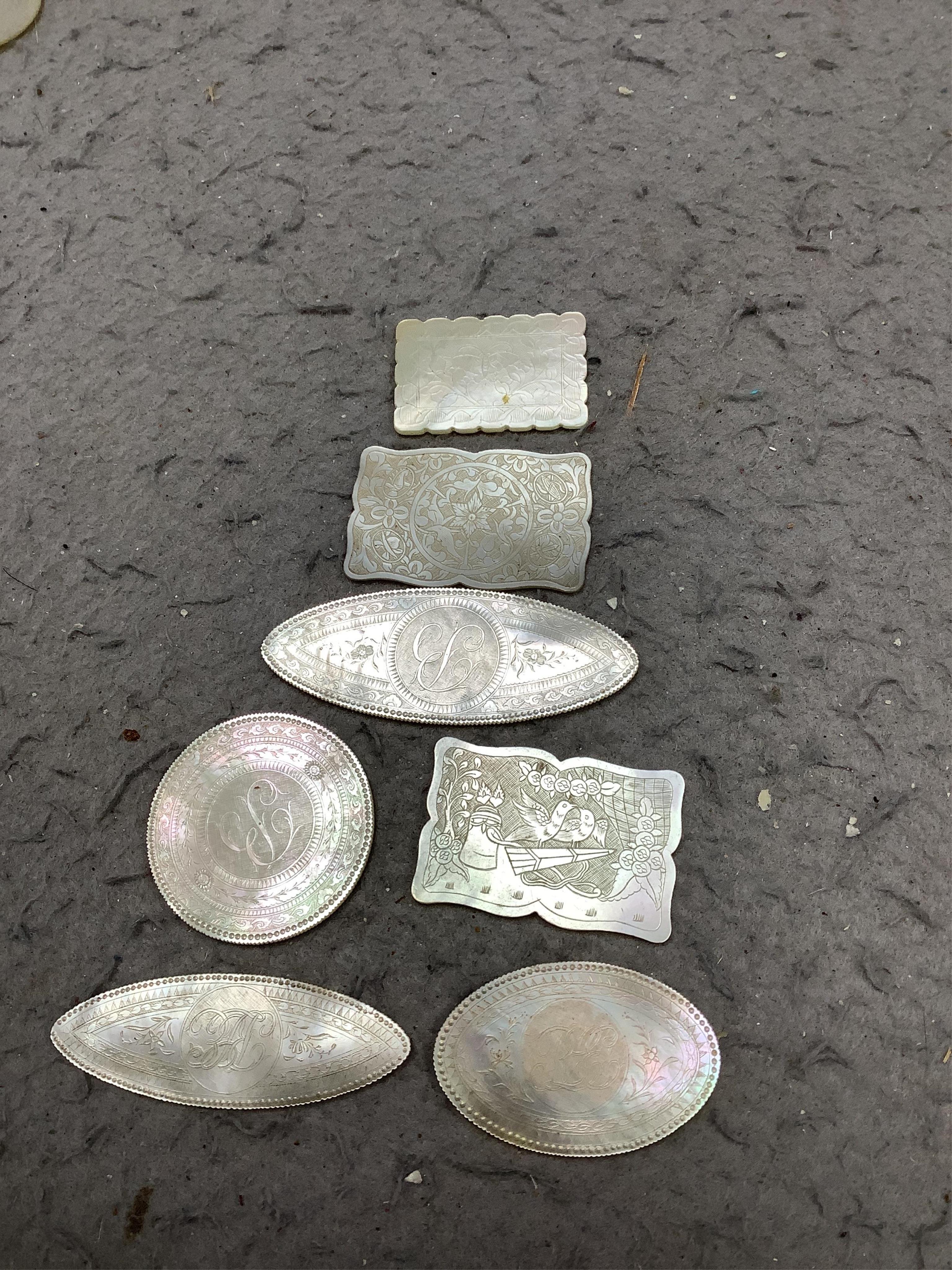 An extensive collection of Chinese mother of pearl gaming counters, in an album. Condition - the majority of the counters in good condition, occasional examples with tiny splinter edge chips